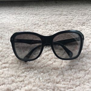 Prada Sunglasses.